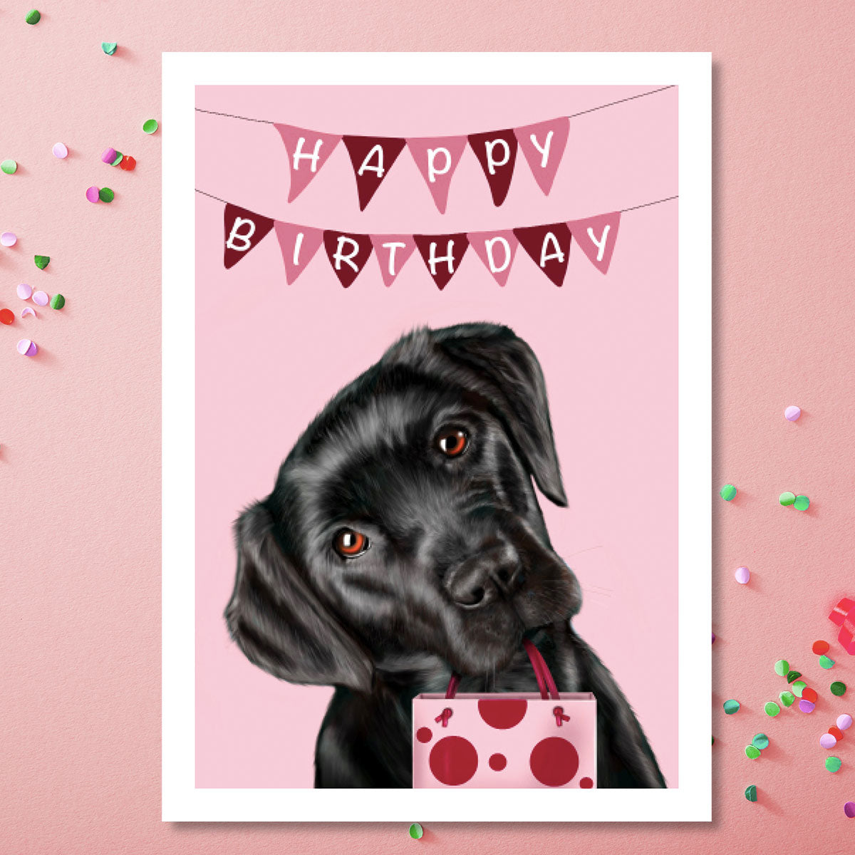 Birthday card with Black Labrador holding gift bag - pink