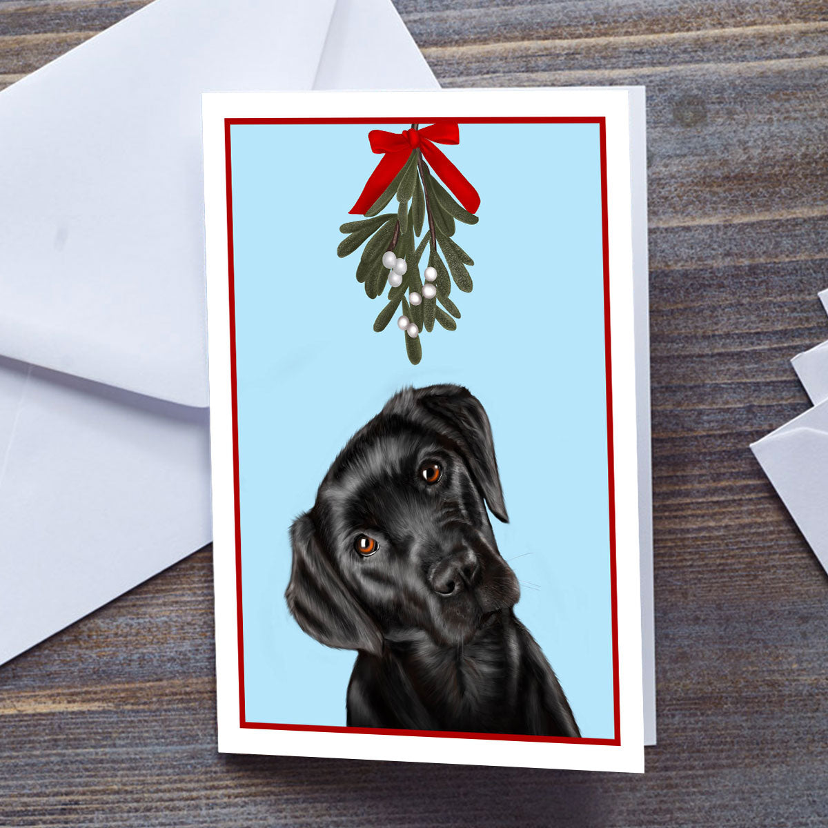 Black Labrador under Mistletoe Christmas card by Oundle Artist Kitty's Art