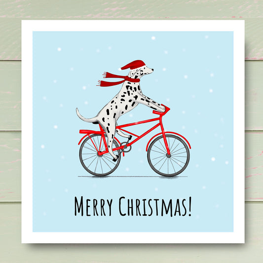 Dalmatian riding bike in the snow with Santa hat. illustrated by Kitty's Art