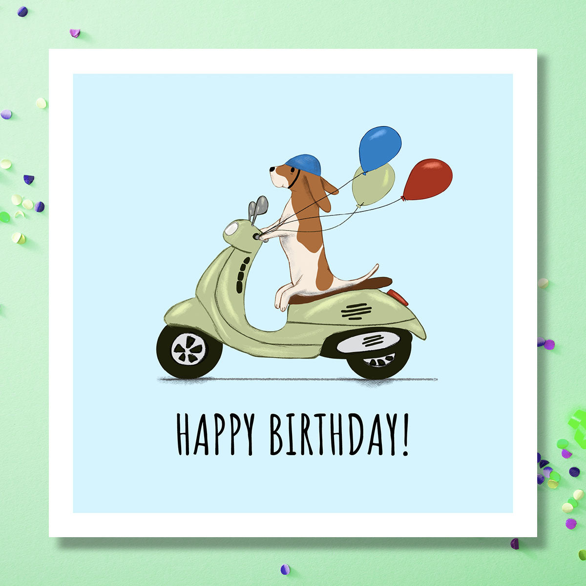 Birthday card with dog riding Vespa holding balloons