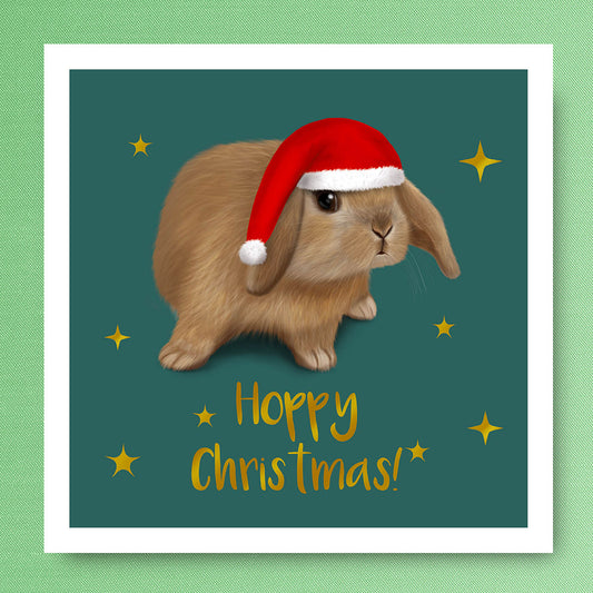 Mini Lop rabbit wearing Santa hat. Christmas Card illustrated by Oundle, Peterborough Artist Kitty's Art