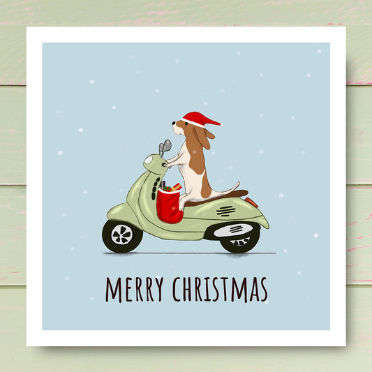 Dog riding a Vespa Scooter wearing Santa hat. Christmas card illustrated by Oundle Artist Kitty's Art