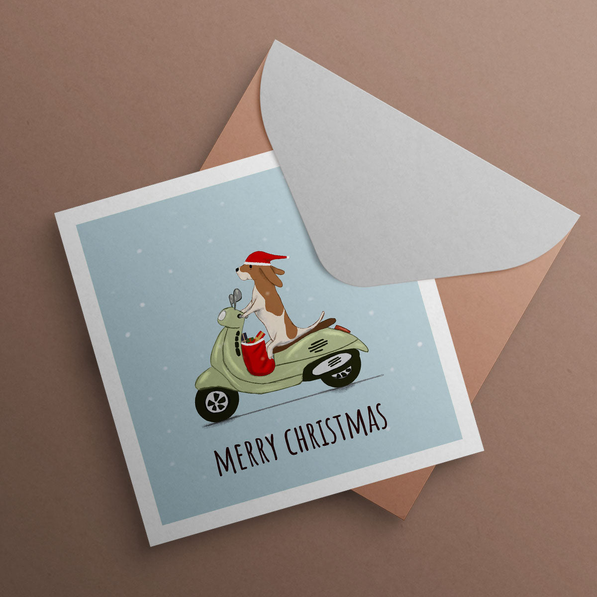 Dog riding a Vespa Scooter wearing Santa hat. Christmas card illustrated by Oundle Artist Kitty's Art