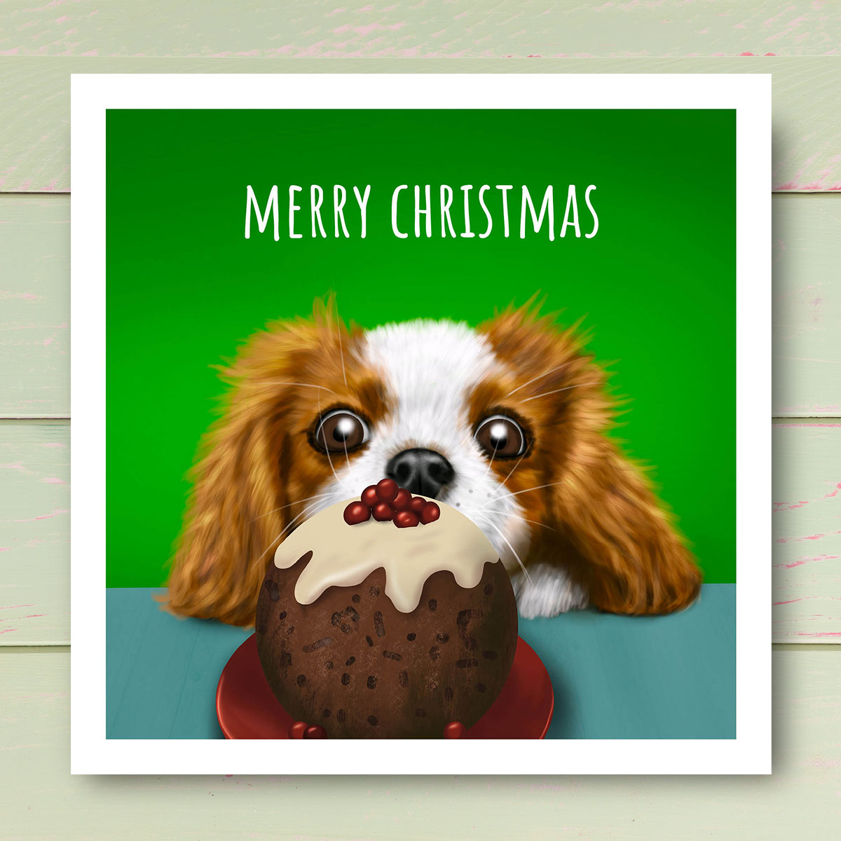 Cavalier King Charles Spaniel staring at Christmas pudding by Oundle Artist Kitty's Art